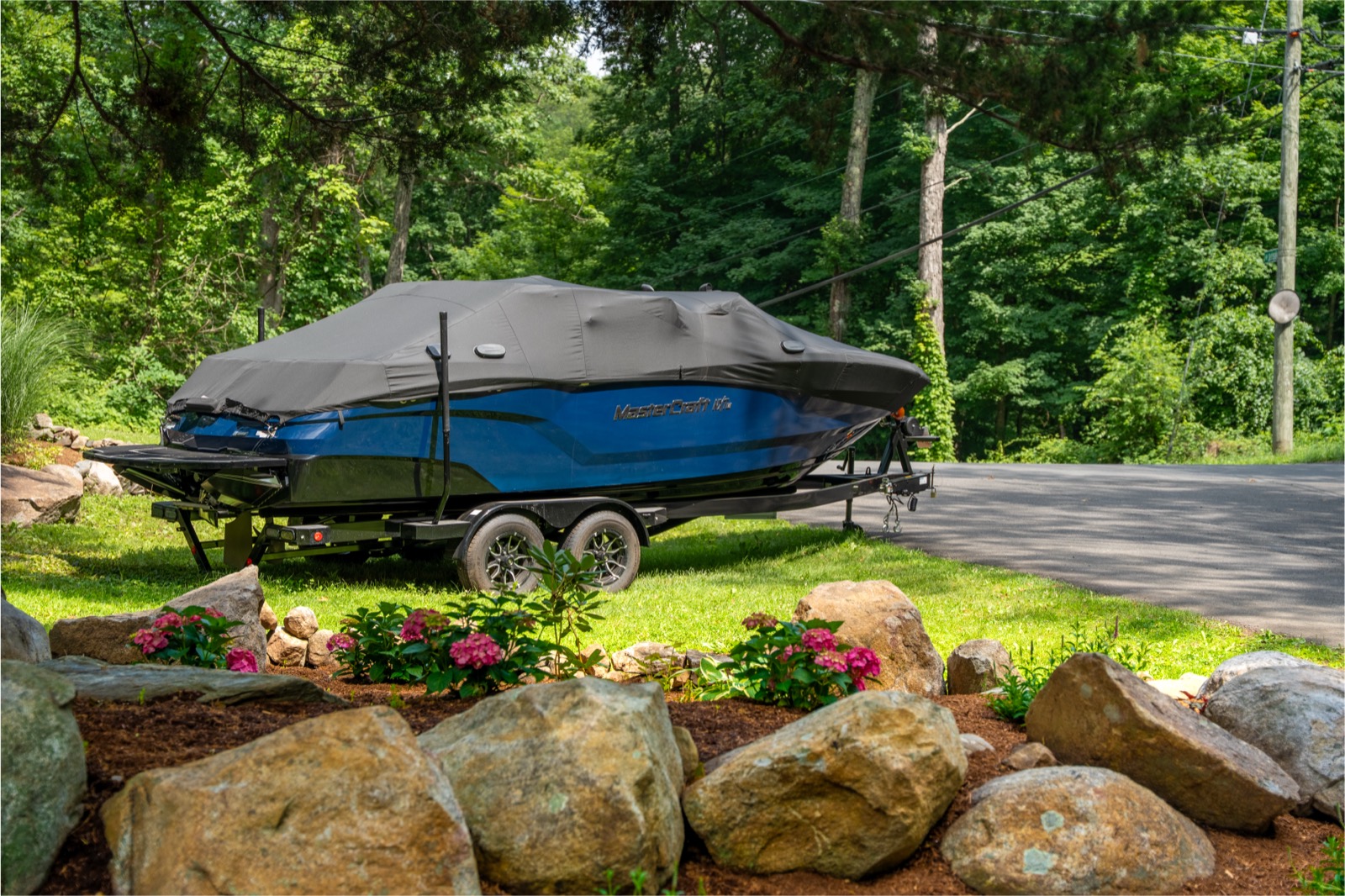 Patio, landscaped grounds and room for the boat