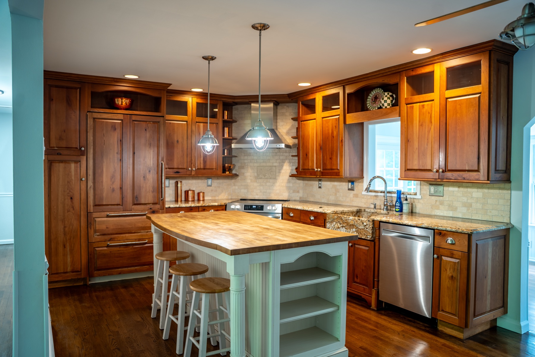 Custom wood kitchen with granite and island