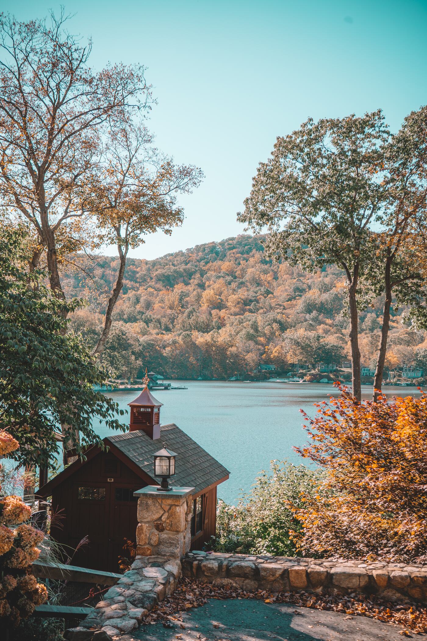 Boathouse on Candlewood Lake with autumn trees